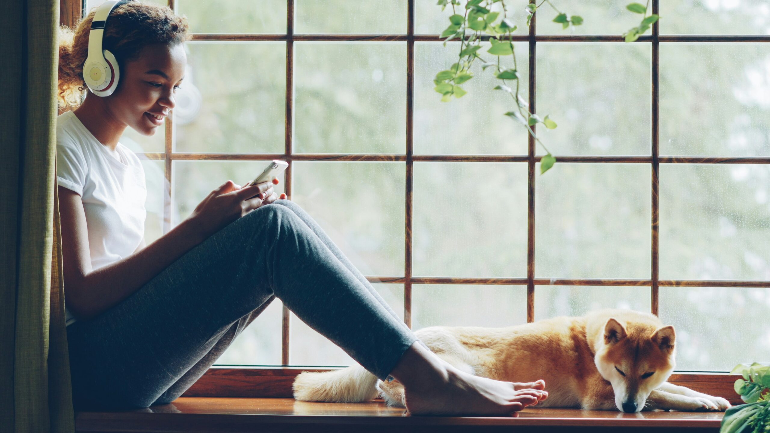 Streaming audio advertising reaches a listener relaxing at home with headphones on