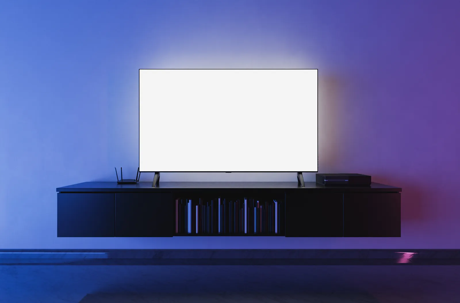 A television on a media unit in a darkened living room